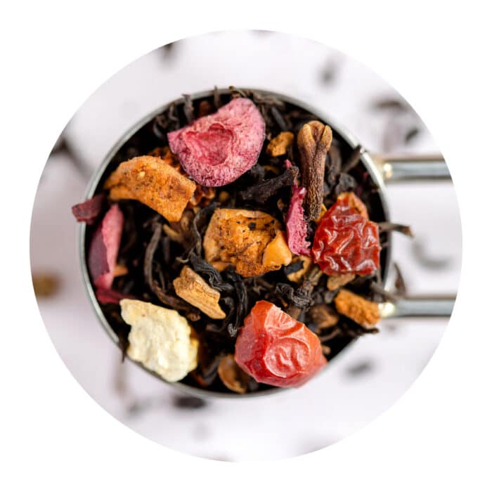 Leafy Bean Co blend called Tea's the season loose leaf tea in a metal tea scoop.